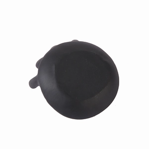 Detail of a black silicone ring tray base in a round shape with raised edge design
