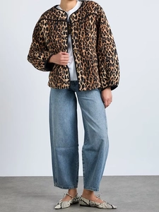 Full view of women's vintage leopard print jacket styled with jeans and matching flats