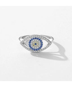 Macro shot of silver S925 sterling silver evil eye ring with blue and clear crystals