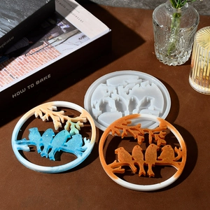 Macro view of bird on branch silicone resin mold with colorful finished coasters