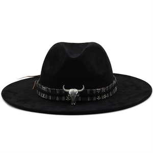 Classic black faux suede cowboy hat with ethnic band and silver bull skull accessory