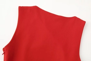 Close-up of neckline and shoulder stitching on a red ruched mini dress