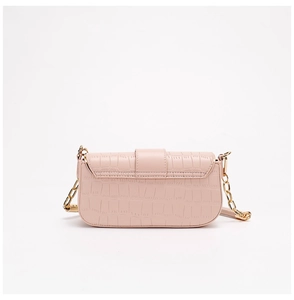 Detailed view of light pink crocodile pattern crossbody bag with gold chain strap