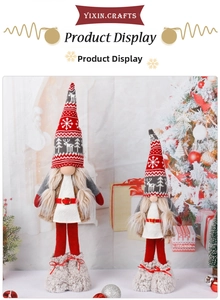 Detailed view of two Christmas gnomes with knitted deer patterns and plush boots