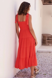 Detail of red tiered midi dress with smocked back and lace-up bow shoulder straps