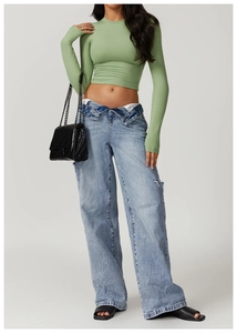Slim fit avocado green long sleeve yoga top with high-waisted wide-leg ripped jeans