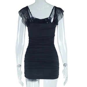 Detail of black slim-fit mini dress featuring ruched texture and sheer mesh ruffle sleeves