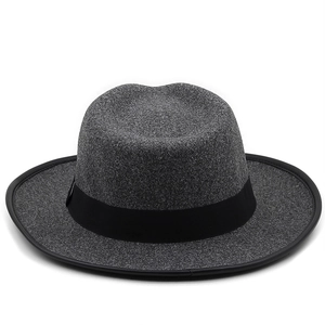 Detailed view of grey fedora hat featuring black grosgrain ribbon and leather trim edging