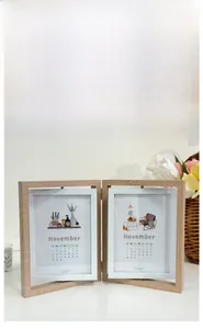 Detail view of the rotating wooden double picture frame with natural grain finish