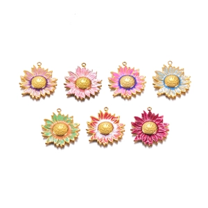 Macro shot of 7 colorful enamel sunflower pendants with gold plating for DIY jewelry making