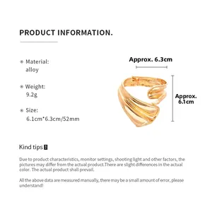 Detail view of golden irregular textured alloy bangle with size and weight dimensions