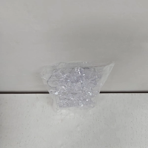 Clear acrylic snowflake ornaments in transparent packaging for Christmas tree decoration
