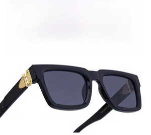 Close-up of golden metal hinge on square punk sunglasses with 52-23-138 size specs