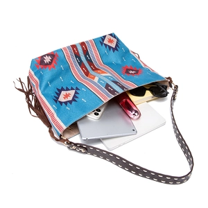 Top view of bohemian woven shoulder bag showing spacious interior with tablet and daily items