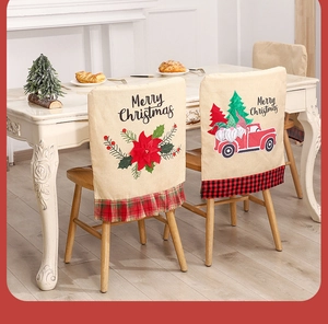 Detailed view of linen Christmas chair covers with festive truck and floral patterns