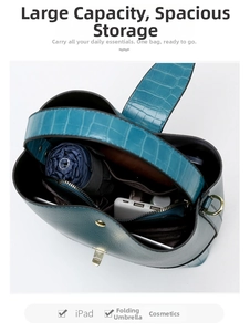 Interior view of emerald bucket bag showing large capacity for iPad and cosmetics