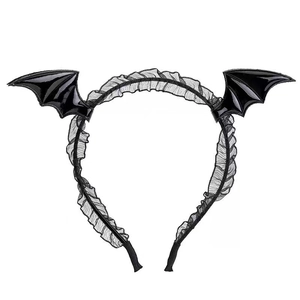 Detail of black bat wing headband with ruffled lace accents for Halloween parties