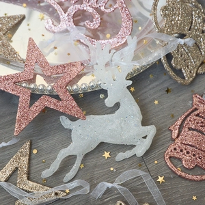Sparkling pink and gold glitter Christmas tree ornaments with elk and star shapes