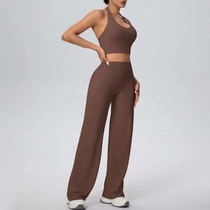 Detail of dark brown halter yoga top and high-waist wide-leg pants sports set