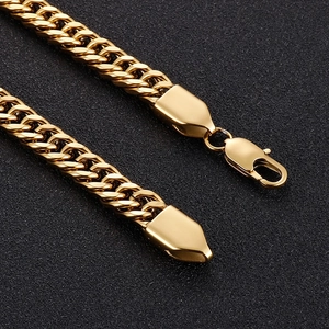 Detail of gold curb chain necklace with secure lobster clasp and polished finish
