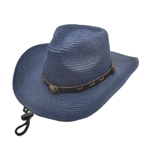 Detail of navy woven cowboy hat with brown leather band, metallic studs and chin strap