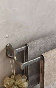 Detail view of double towel rack with layered design and convenient hooks in gun grey