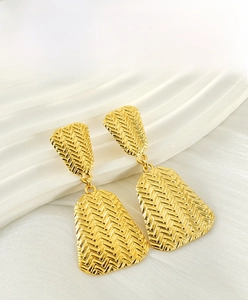 Macro detail showing woven texture on 18K gold-plated irregular geometric earrings
