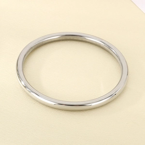 Close-up of a 6mm polished silver stainless steel bangle with a sleek minimalist finish