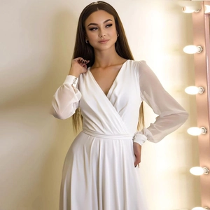 Elegant white V-neck chiffon dress with translucent long sleeves and rhinestone cuffs
