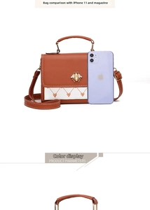 Brown crossbody bag with bee ornament compared with iPhone 11 for size reference