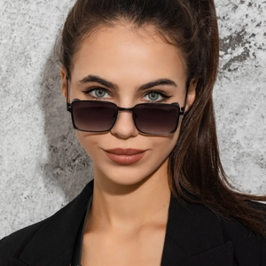Detailed close-up of retro square metal sunglasses with gradient lenses on a male model