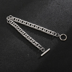 Detailed view of silver titanium steel curb chain bracelet with industrial OT buckle closure