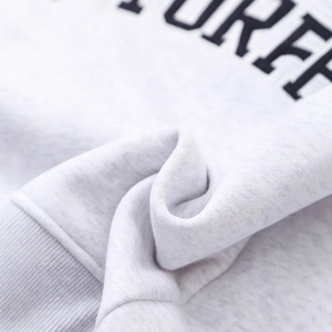 Light gray knit sweatshirt featuring embroidered RFF lettering and ribbed cuff detail