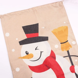 Close-up of linen fabric texture featuring a cartoon snowman with a broom and hat