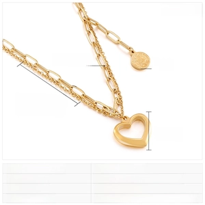 Detailed view of layered gold heart and coin pendant necklace with size specifications