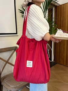 Red large capacity striped drawstring tote bag with logo patch for casual commuting