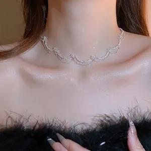 Elegant silver butterfly zircon necklace with layered tassel chains on a model