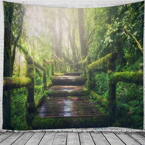Detail of forest tapestry with mossy path and sunlight hanging on white brick wall