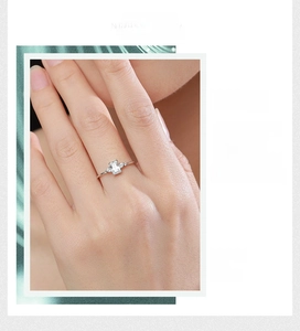 Detail of s925 silver ring featuring rectangular step-cut cubic zirconia in three-stone style