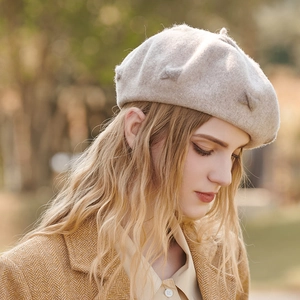Elegant oatmeal wool beret for women with bow detail, perfect for autumn and winter style