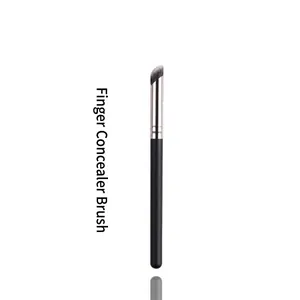 Detail of angled concealer brush with dense synthetic bristles and matte black handle