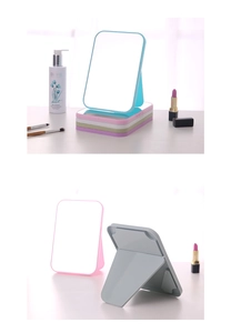 Detail of portable folding makeup mirrors in various colors with adjustable stands