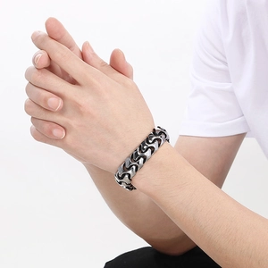 Close-up of men's vintage punk style square buckle chain bracelet in vacuum-plated titanium steel