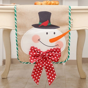 Christmas burlap table runner with snowman pattern and a red polka dot 3D bow