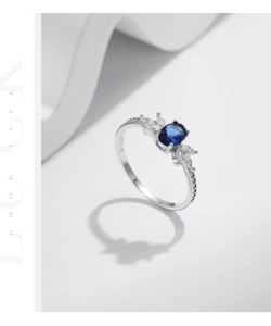 Macro shot of S925 sterling silver ring showing the oval blue sapphire and fine setting