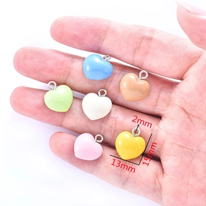 Set of 6 colorful resin heart charms 13x15mm for DIY jewelry making held in palm
