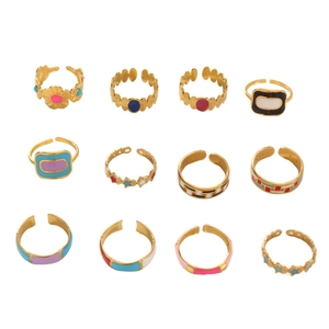 Set of 12 colorful enamel rings in 18k gold plating featuring floral and geometric designs