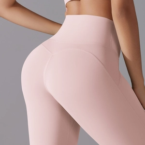 Close-up of pink high-waisted yoga leggings with ergonomic butt-lifting seam design