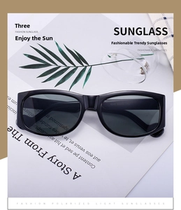 Close-up of stylish black rectangular sunglasses on modern aesthetic background