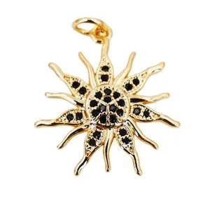 Detailed close-up of a sunflower pendant with black zircon inlays and 18K gold plating